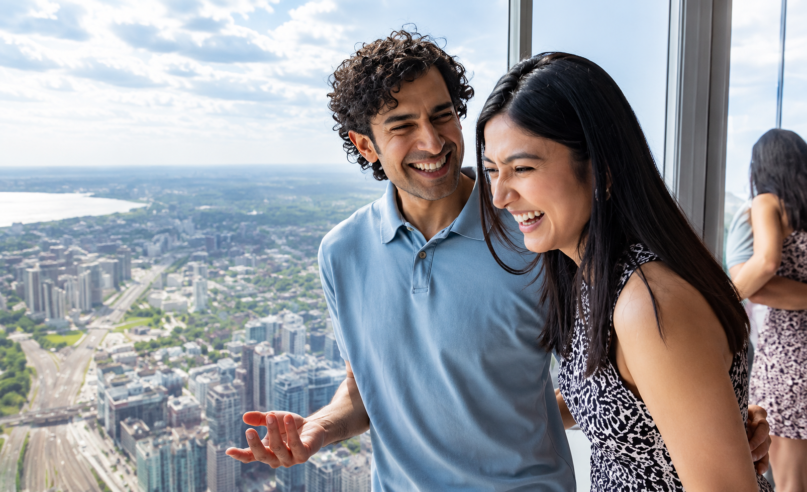 Couple posing with the Toronto skyline