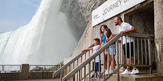 Family posing at Journey Behind the Falls