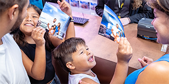 Family choosing their souvenir photos