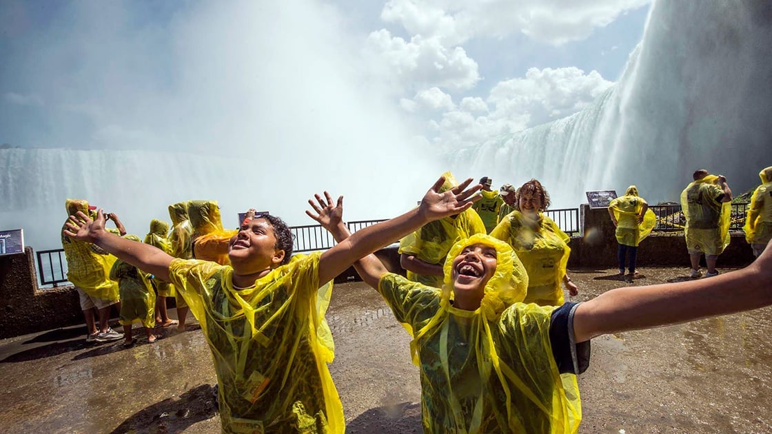 Guests celebrating in front of Niagara Falls